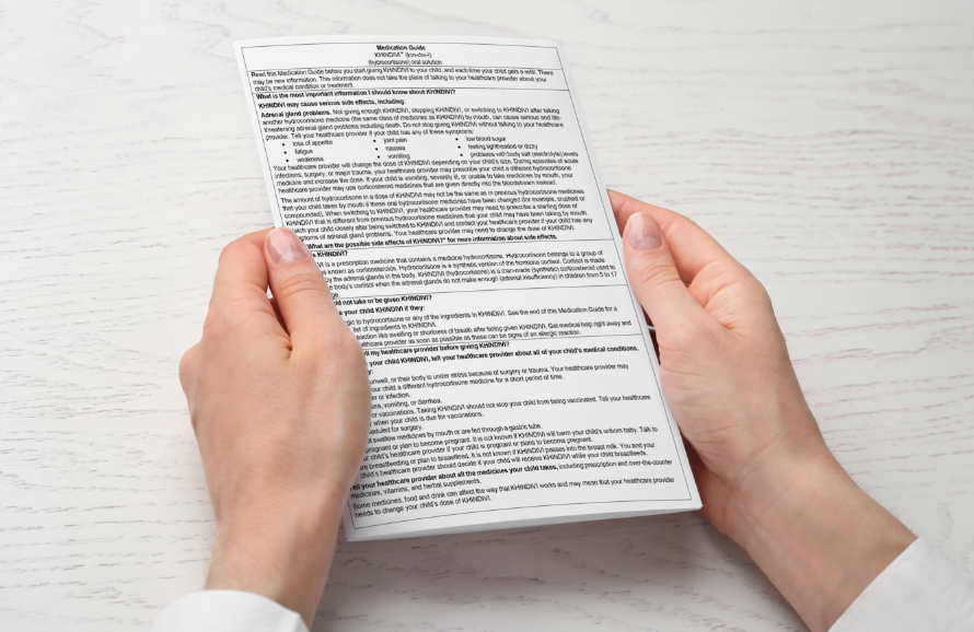 A Medication Guide held by hands.